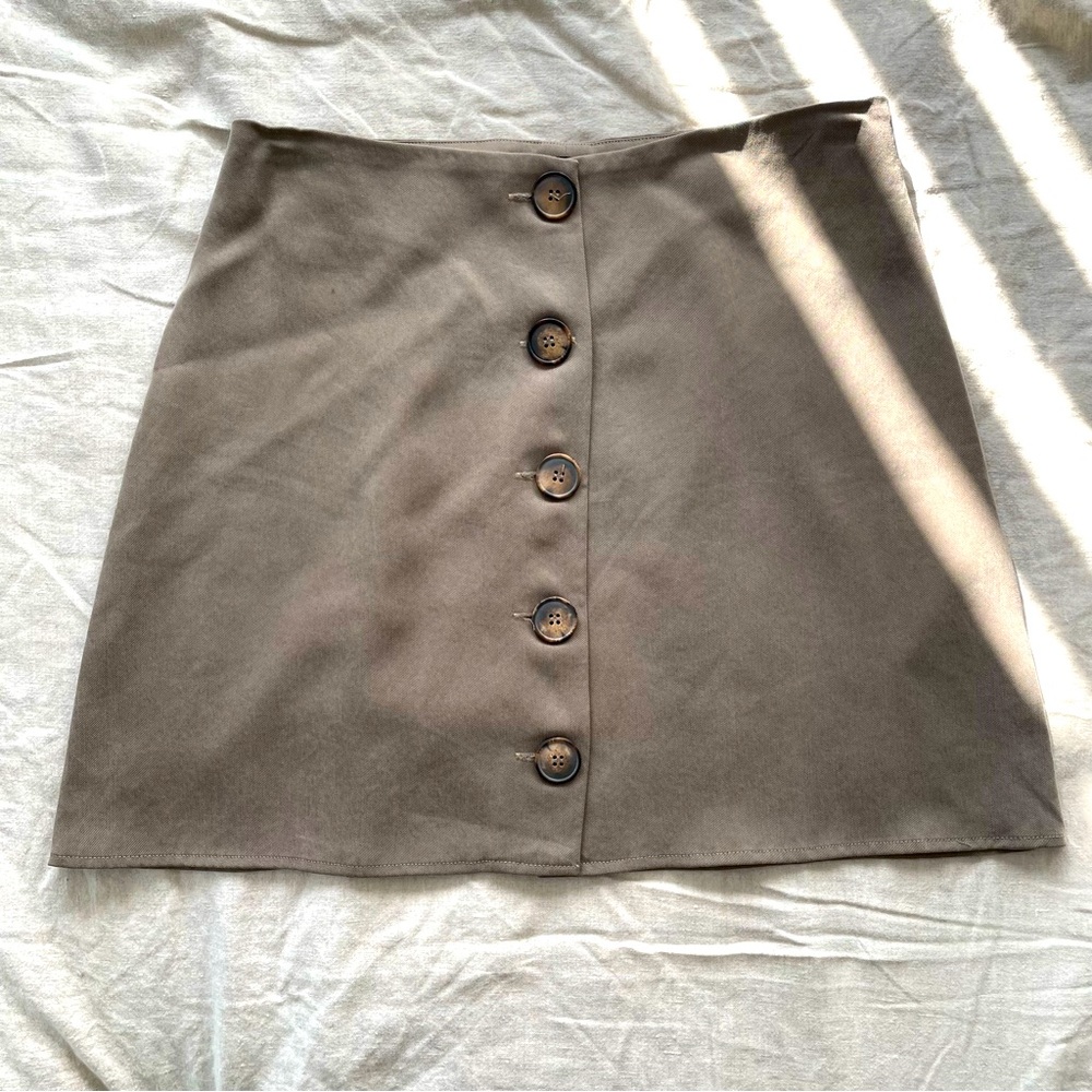 Reformation a-line mini skirt with tortoiseshell buttons